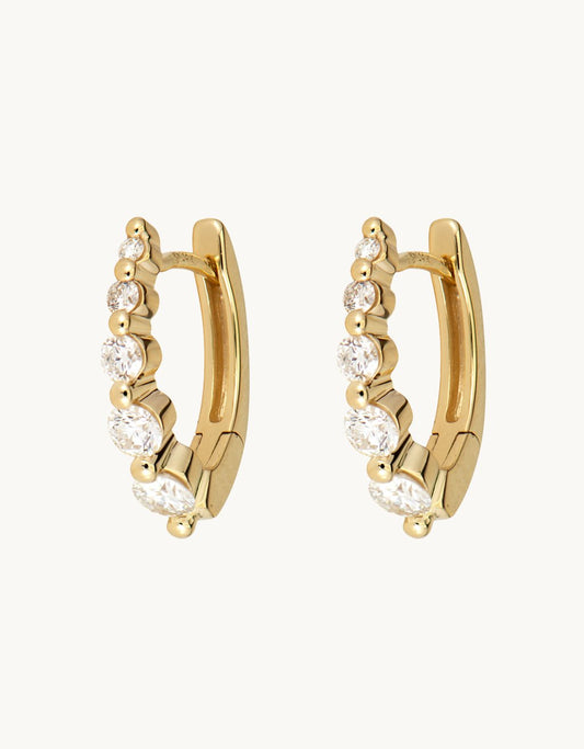 three stories Small Oval Graduated Diamond Huggie Hoops